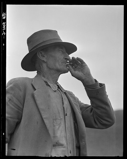 Untitled photo, possibly related to: This man is a labor contractor in the pea fields of California. "One-Eye" Charlie gives his views. "I'm making my living off of these people (migrant laborers) so I know the conditions." San Luis Obispo County, California