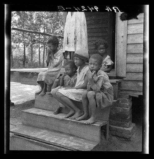 Untitled photo, possibly related to: Turpentine worker's family near Cordele, Alabama. Father's wages one dollar a day. This is the standard of living the turpentine trees support