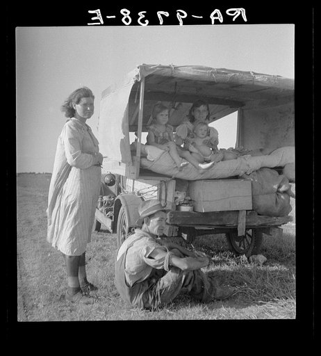 Untitled photo, possibly related to: Family between Dallas and Austin, Texas. The people have left their home and connections in South Texas, and hope to reach the Arkansas Delta for work in the cotton fields. Penniless people. No food and three gallons of gas in the tank. The father is trying to re