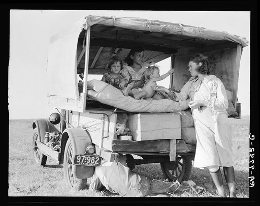 Untitled photo, possibly related to: Family between Dallas and Austin, Texas. The people have left their home and connections in South Texas, and hope to reach the Arkansas Delta for work in the cotton fields. Penniless people. No food and three gallons of gas in the tank. The father is trying to re