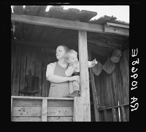 Untitled photo, possibly related to: Mrs. William Sharrard and one of her children. Her husband has been a farmer of the cut-over regions for years, but cannot make a living at it. The family is on relief. Near Silk Lake, Michigan
