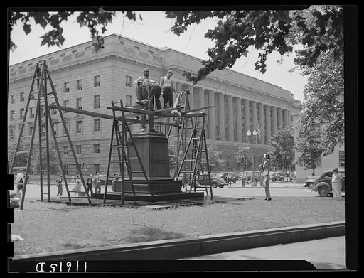 Untitled photo, possibly related to: Washington, D.C. Workmen from a monument cleaning company cleaning Shepherd's statue at 14th and E Street, N.W.