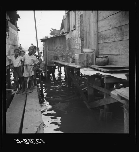 Untitled photo, possibly related to: Shacks built over tidal swamp in the workers' quarter of Porta de Tierra. San Juan, Puerto Rico
