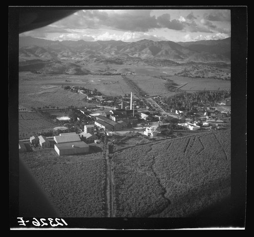Untitled photo, possibly related to: Air view of sugar refinery surrounded by fields. Near Ponce, Puerto Rico