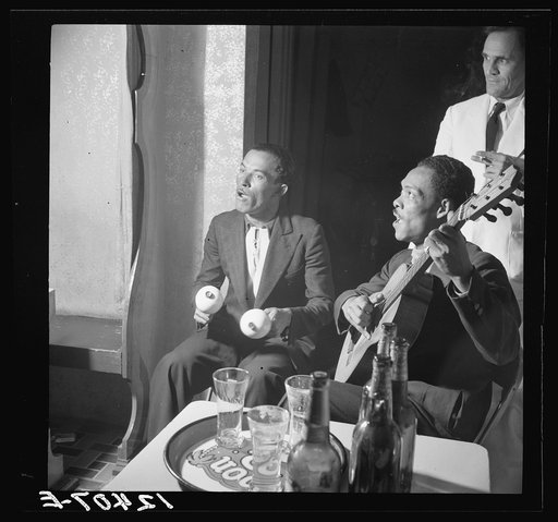 Untitled photo, possibly related to: Itinerant musicians in a bar. Rio Piedras, Puerto Rico