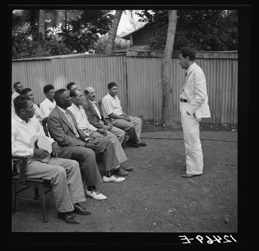Untitled photo, possibly related to: Members of sugar refinery cooperative being addressed by project manager. Central Lafayette, Puerto Rico