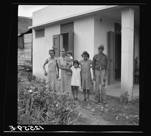 Untitled photo, possibly related to: A Puerto Rican family of 5.2. A resettler's family in front of their hurricane-proof house on La Plata project. Puerto Rico