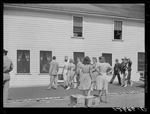 Untitled photo, possibly related to: Tourists, fresh off the boat from Boston. With only two hours in town, they buy seashells, dinners, trinkets, and rides on the sightseeing bus. Provincetown, Massachusetts