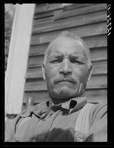 Untitled photo, possibly related to: Tourist house, Truro. Cape Verde Islander (Portuguese) who came to this country more than forty years as a fisherman later took work on the railroad. After thirty years on the railroad he had a stroke, now makes most of his income from boarding tourists in his lo