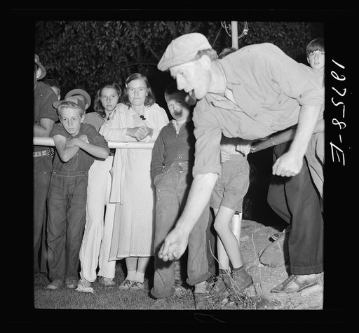 Untitled photo, possibly related to: Pitching pennies. Band concert. Lincoln, Vermont