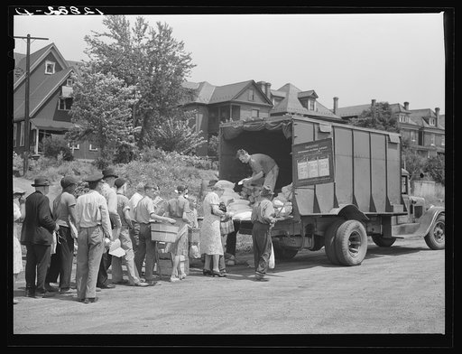 Untitled photo, possibly related to: Distribution of surplus commodities near the railroad station. Huntingdon, Pennsylvania