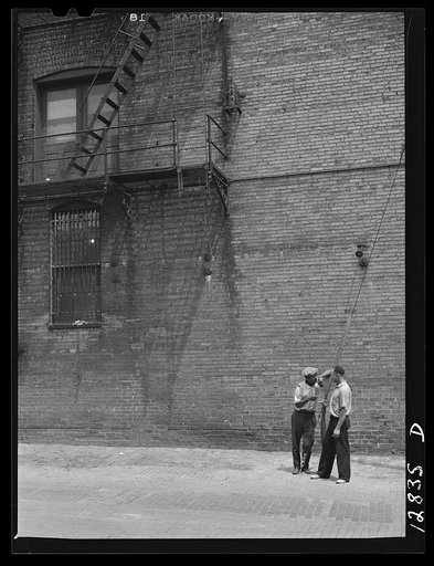 Untitled negative showing a street scene with two men, Washington, D.C.