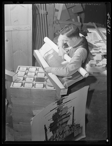 Washington, D.C. Preparing the defense bond sales photomural, to be installed in the Grand Central terminal, New York, in the visual unit of the Farm Security Administration. Packing finished print strips for one unit, keyed by code according to the dummy, for future assembly