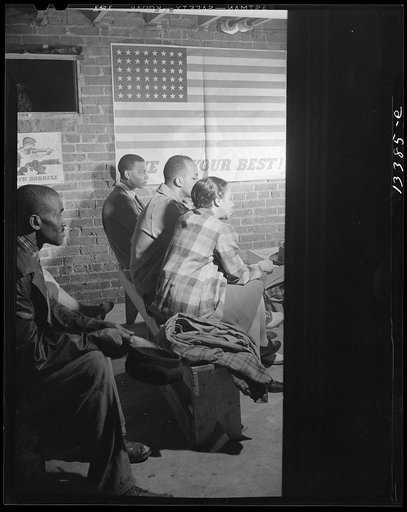 Untitled photo, possibly related to: Washington, D.C. Air raid wardens' meeting in zone nine, Southwest area. Elmer House, federal worker by day and on air raid duty at night, outlining plans for his sector