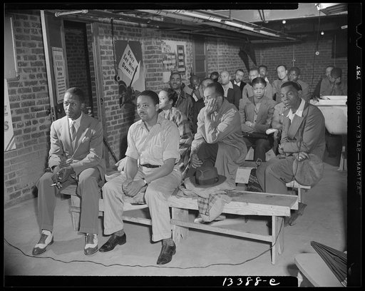 Untitled photo, possibly related to: Washington, D.C. Air raid wardens' meeting in zone nine, Southwest area. Elmer House, federal worker by day and on air raid duty at night, outlining plans for his sector