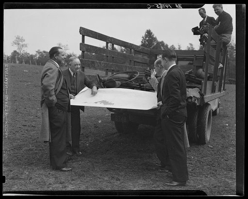 Untitled photo, possibly related to: Officials examining plan of Greenbelt, Maryland