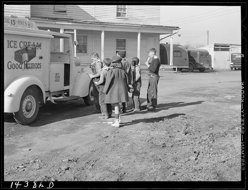 Untitled photo, possibly related to: Good Humor man comes to trailer camp on Saturday afternoon. These children are sons of torpedo plant workers in Alexandria, Virginia