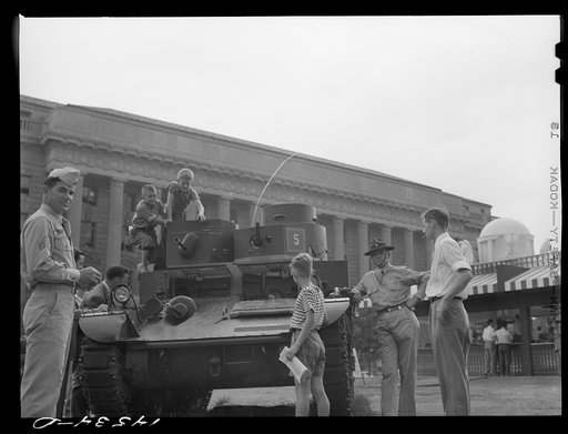 Untitled photo, possibly related to: Children at National Defense exhibit on Commerce Square. Washington, D.C.