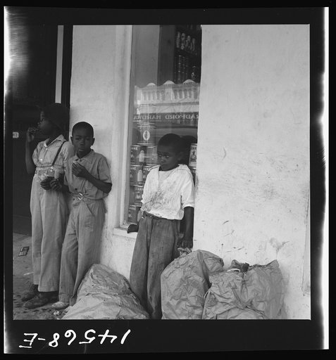 Untitled photo, possibly related to: Negro boys eating popsicles. At Starke, Florida