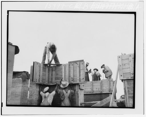 Rammed earth construction, near Birmingham. Form sections should not be larger than can be handled by a crew of three or four men. Alabama