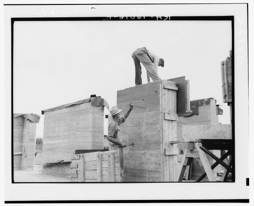 Rammed earth construction near Birmingham, Alabama. The bolts are removed and the holes plugged with mortar