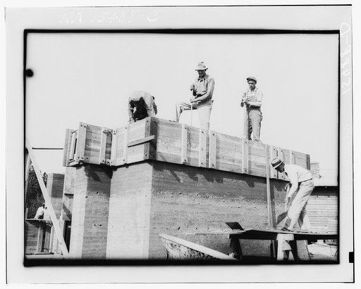 Rammed earth construction near Birmingham, Alabama. Three-inch layers are tamped in the forms until it is filled