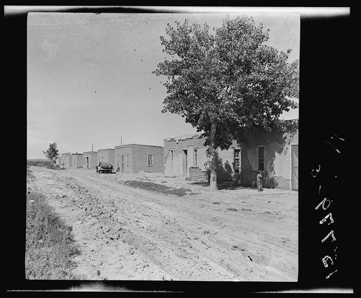A colony of twenty adobe houses built by the inhabitants with materials supplied by the Great Western Sugar Company. Thirteen of the houses are used, seven being unfit for habitation. In the thirteen houses, there live approximately fifty people. Being in limits of an incorporated town (Hudson) ther
