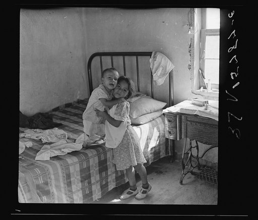 A girl of six who has full charge of her boy brother. Great Western Sugar Company's beet sugar workers' colony at Hudson, Colorado. It is due to the fact that her mother "works outside somewhere"