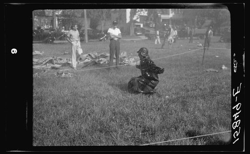 Firemen's muster. Boothbay center, Maine. Coach directing those crew to take best advantage of the wind. Note that he is under the hose stream