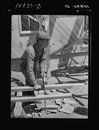 Vernon Hardcastle, tenant purchase client, working on new home. Wheeler County, Texas