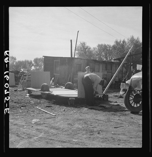 Building an auto trailer in a squatter camp. Outskirts of Bakersfield, California