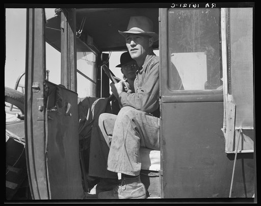 Carrot pullers from Texas. Texas farmer on edge of carrot field. In California for two weeks, migrating after three years of crop failures. Combined earnings, man and wife tying carrots: One dollar and twelve cents a day