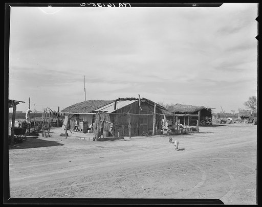 Housing typical of that afforded Mexican field workers of the Imperial Valley. These people are not migrants, but live on the edge of the ranches and work in peas and melons