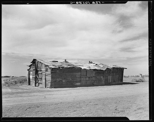 Housing typical of that afforded Mexican field workers of the Imperial Valley. These people are not migrants, but live on the edge of the ranches and work in peas and melons