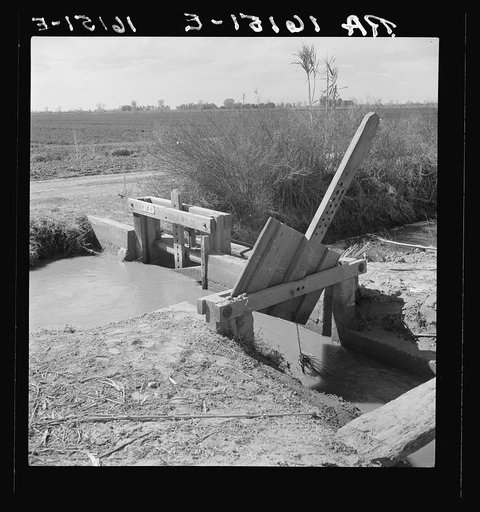 Irrigation ditch alongside the road. Imperial Valley, California