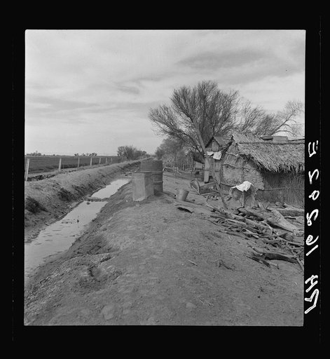 Ditch bank housing for Mexican field workers. Imperial Valley, California
