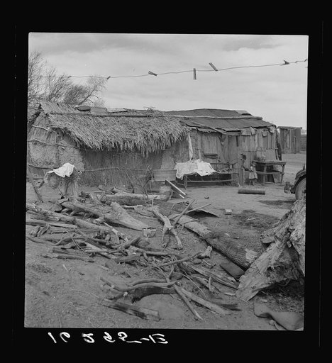 Ditch bank housing for Mexican field workers. Imperial Valley, California