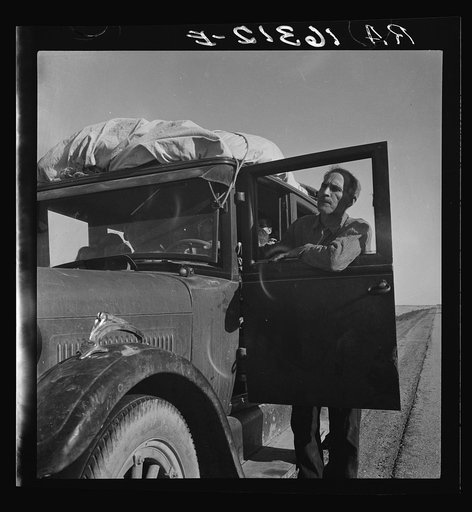 Stalled on the desert, facing a future in California. No money, ten children. From Chickasaw, Oklahoma. Southern California