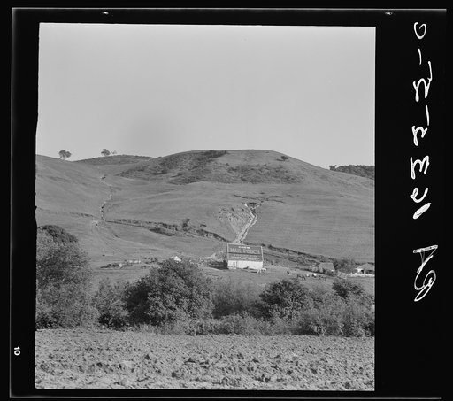 Soil erosion in California hills. Small dairy ranch near Gibson, California