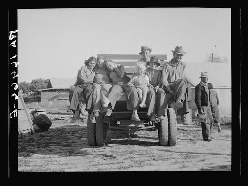 California pea pickers returning to camp after a day's work in the field. Near Santa Clara, California