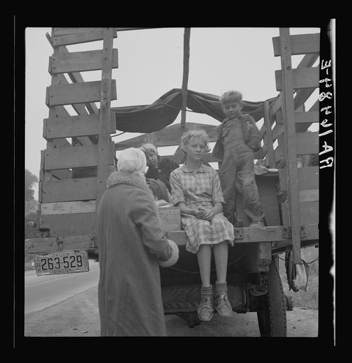 Family of ex-sharecroppers from Arkansas, near Little Rock, on California highway. Tehachapi grade