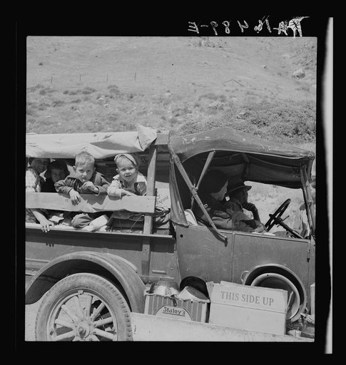 Family of drought refugees on U.S. 99 near Bakersfield, California