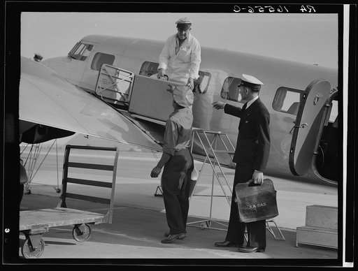 Unloading baggage for inspection after arrival of plane from Mexico. Glendale Airport, California