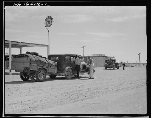 Untitled photo, possibly related to: Family of nine from near Fort Smith, Arkansas, on their way to try to find work in the California harvests. Between Yuma and Phoenix, Arizona. Fourteen such cars were passed one afternoon on this highway