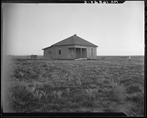 Abandoned house and land, Hall County, Texas. There were formerly twelve families employed on this land, now there are none