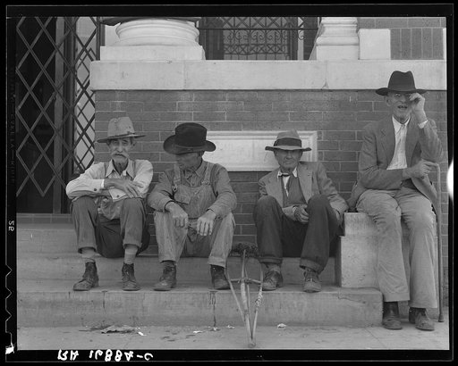 On the steps of the bank in the town square. Memphis, Texas