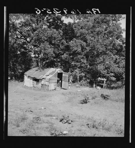 Family camped on U.S. Highway 63. Cache County, Oklahoma