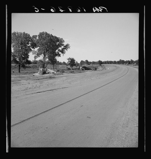 Family camped on U.S. Highway 63. Cache County, Oklahoma