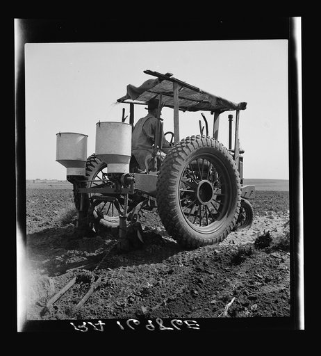 Tractor and operator. Navarro, Texas