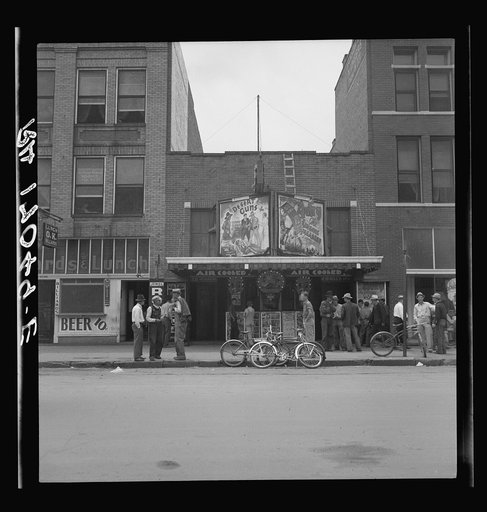 Idle men attend the morning movies. There are three such movies in one block. Oklahoma City, Oklahoma